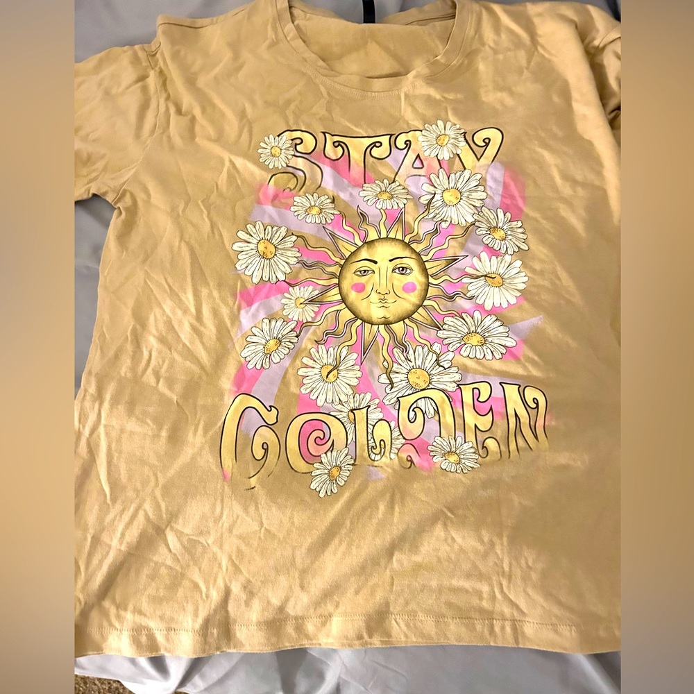 The size is the shirt is XL and the color of the shirt is tan